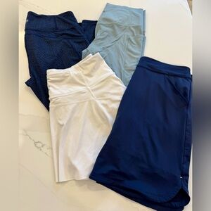 Set of 4 Athleta leggings and tennis skort + Peter Millar golf skirt size Large